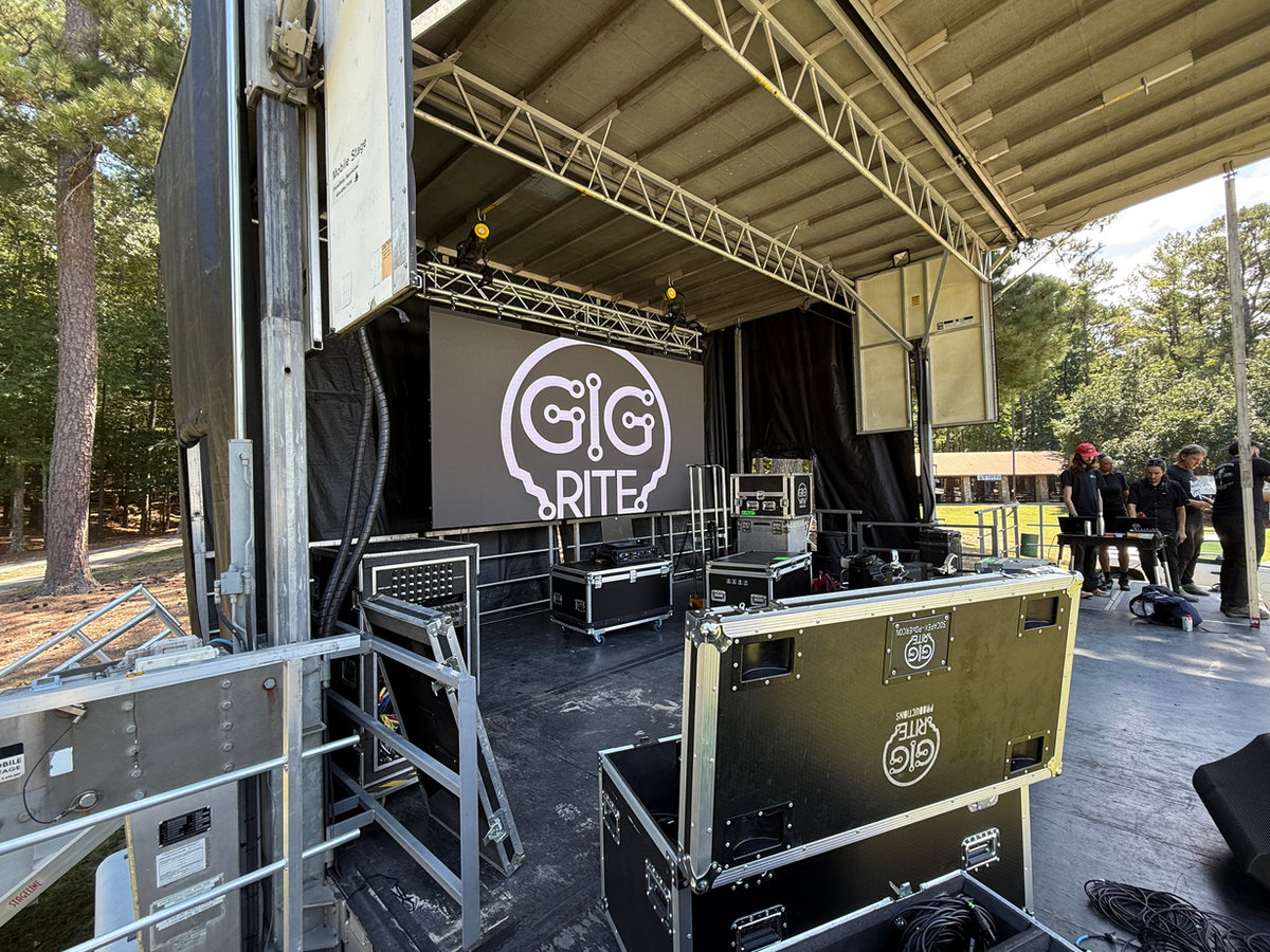 Stage build and backline load-in for a live event produced by GigRite in Atlanta